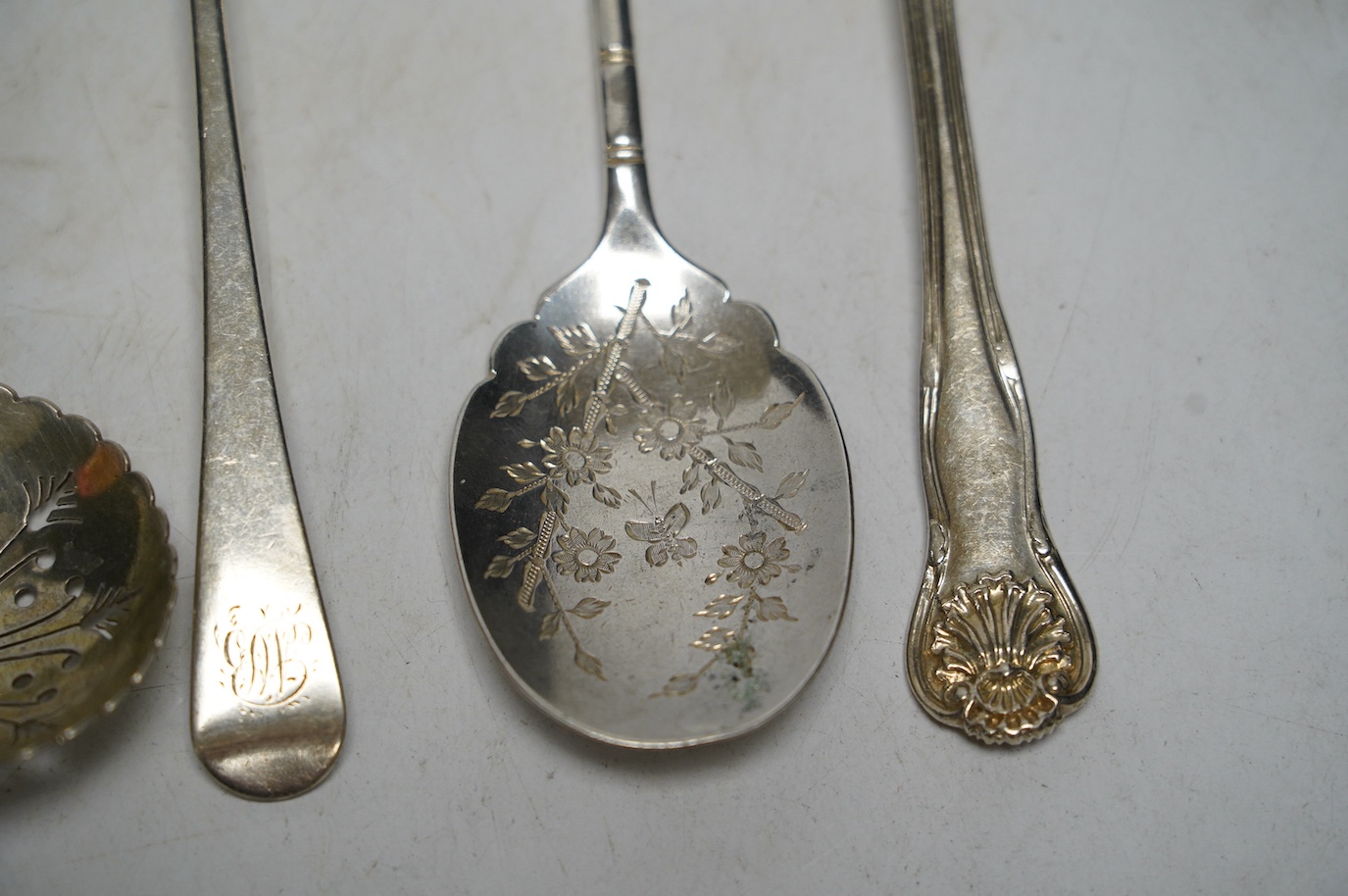 A set of six George III silver Old English pattern dessert spoons, Soloman Hougham, London 1802, a set of six later silver teaspoons, London, 1842 and a quantity of assorted silver flatware, 28.2oz. Condition - poor to f